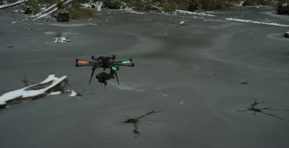 A drone flying over a river