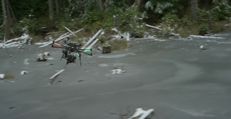 A drone flying over a river