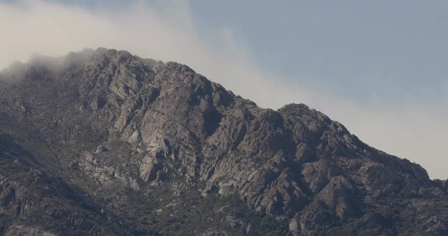 Mountain range sits under a blue sky