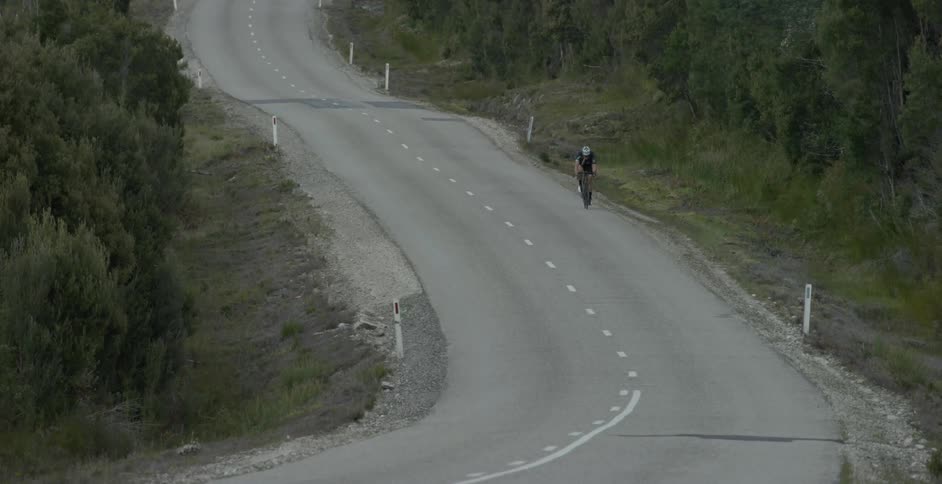 Lone cyclist travels down the highway