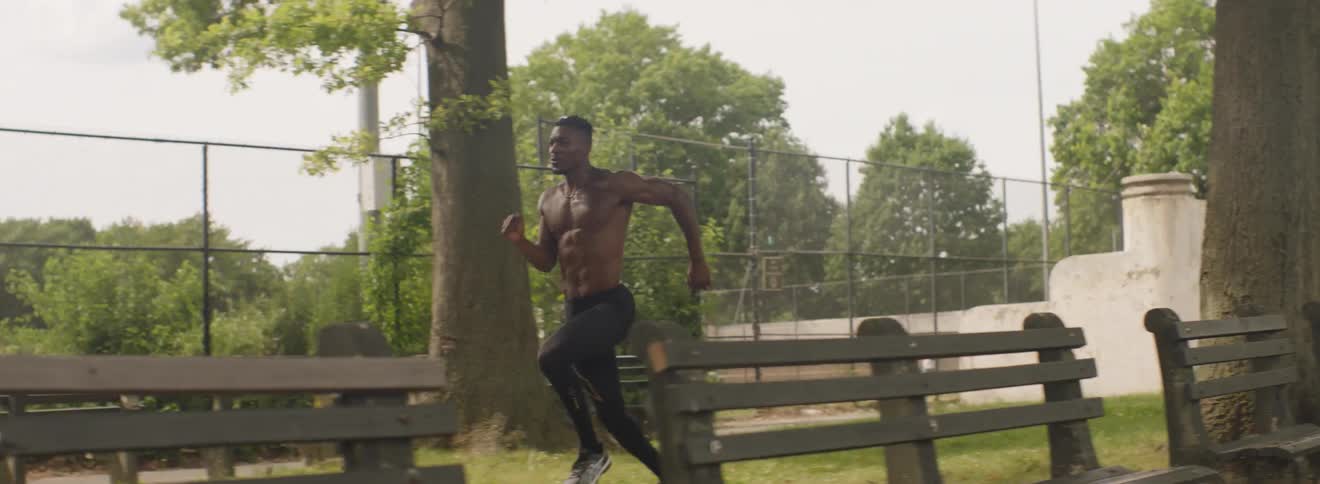 A man runs through a park