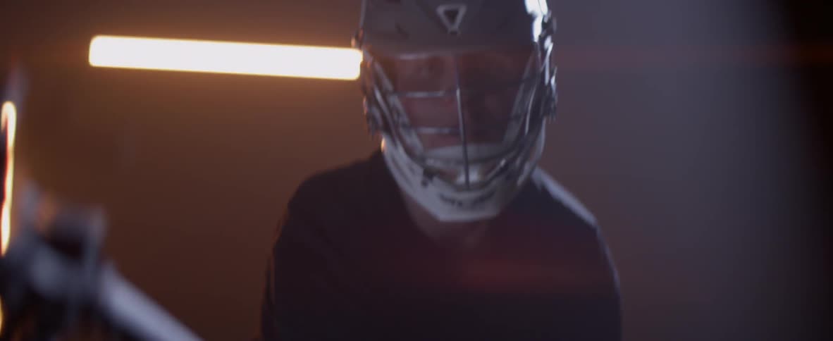 A lacrosse player waves his stick around