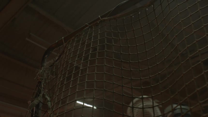 Person in a white helmet hits the webbing of a net