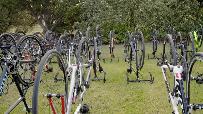 Upside down bicycles in a field