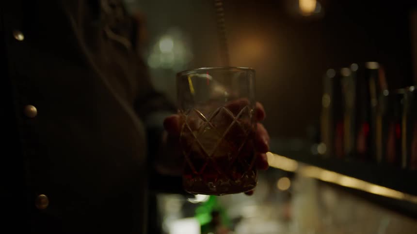 A man is mixing a drink