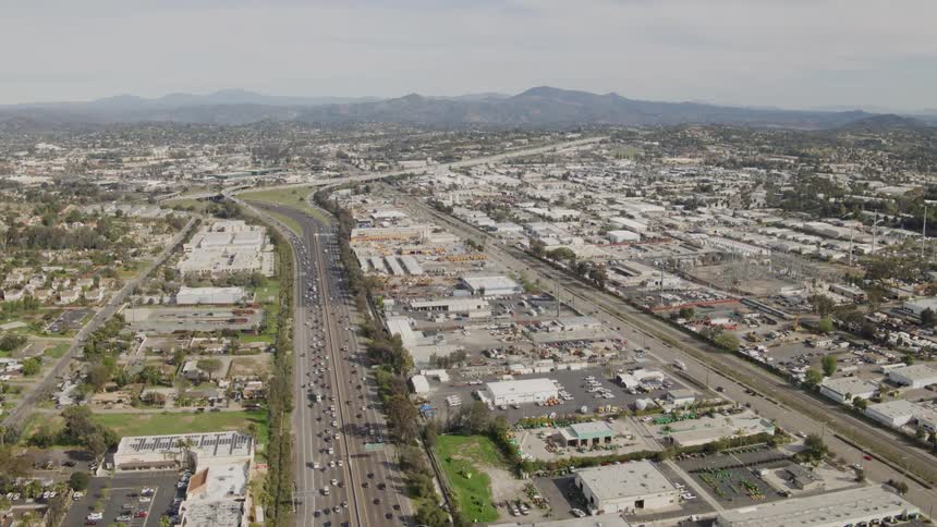 Vehicles travel along a city highway