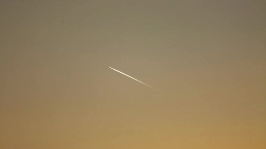A plane flies in the sky overhead