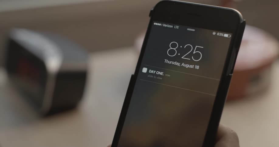 A person checks their phone