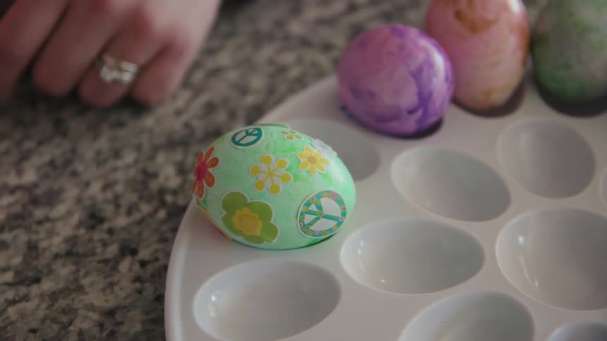 Close up of colored eggs with stickers on them