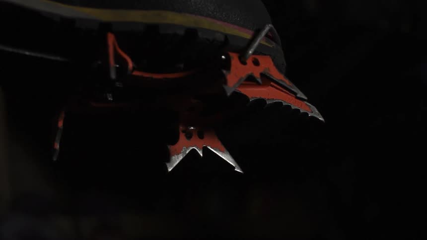 The boot has ice climbing blades attached