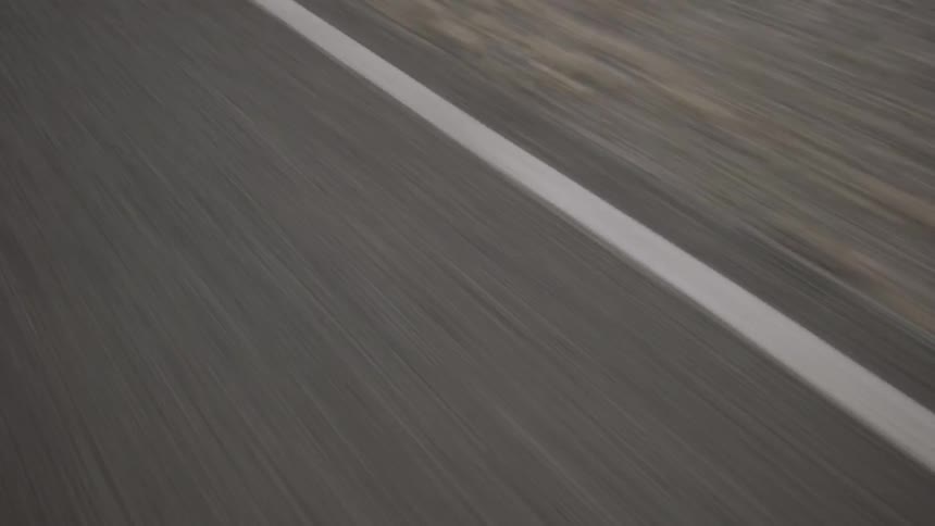A road passes beneath a moving vehicle