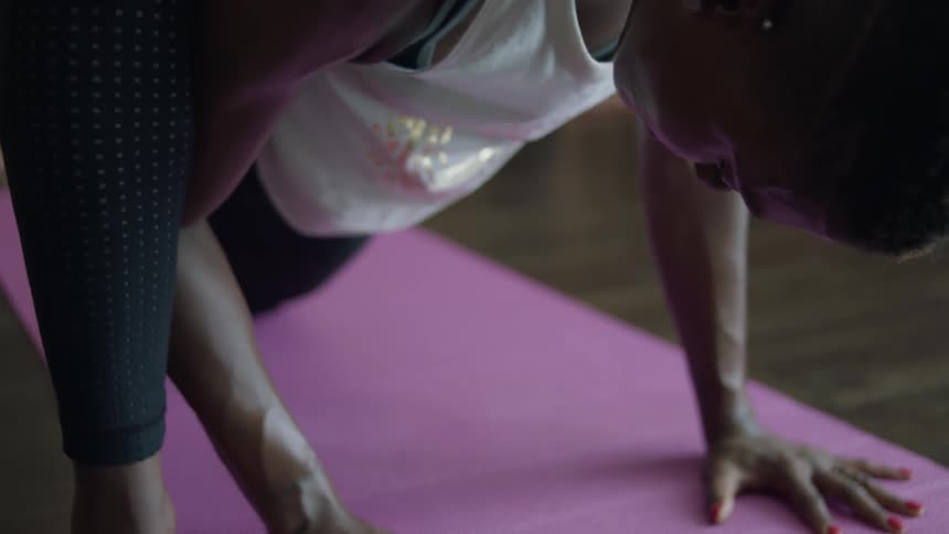 A woman is practicing yoga