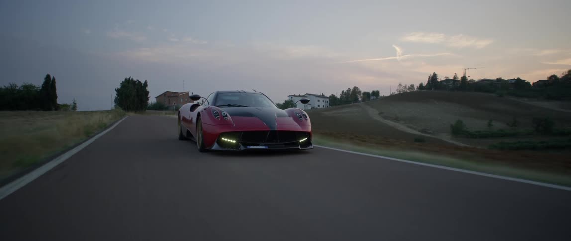 A person drives a fast sports car