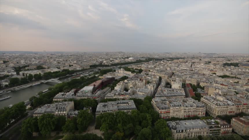 City buildings are shown at sunset