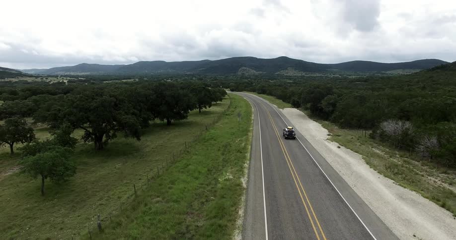 A truck rides down the road