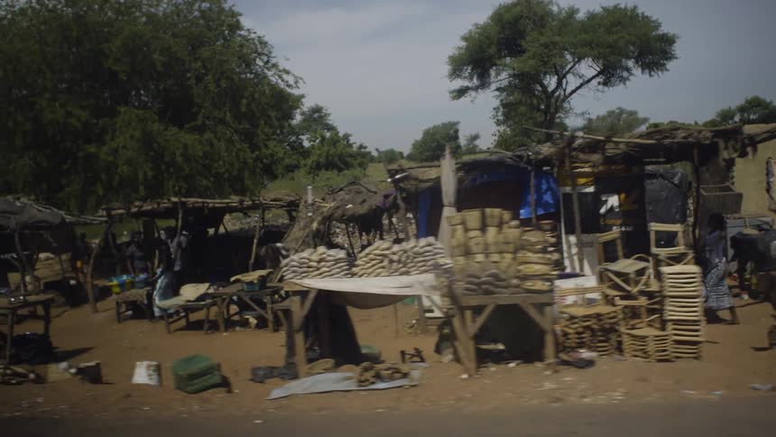 View of a small village and people walking among it