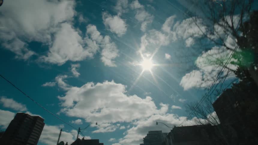 The city has a partially cloudy sky above