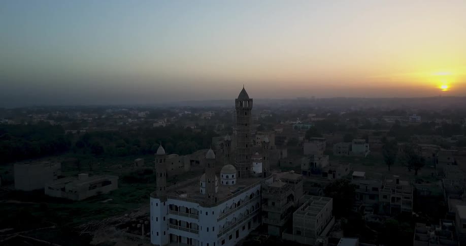 The sun sets on a city landscape