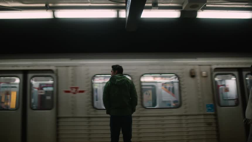 A man waits for a train