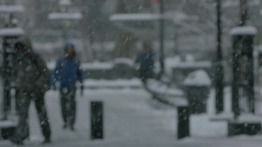 People walk and travel in the heavy snow
