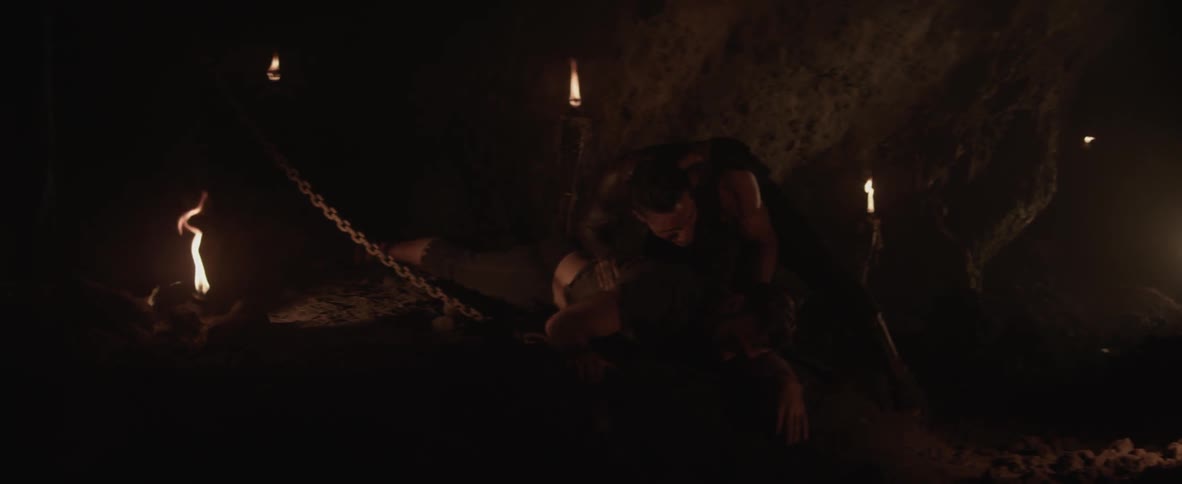 A man cradles a different dead man