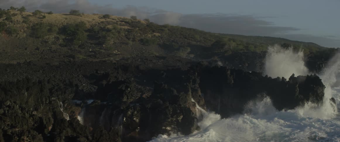 The cliffs are surrounded by heavy waves hitting constantly