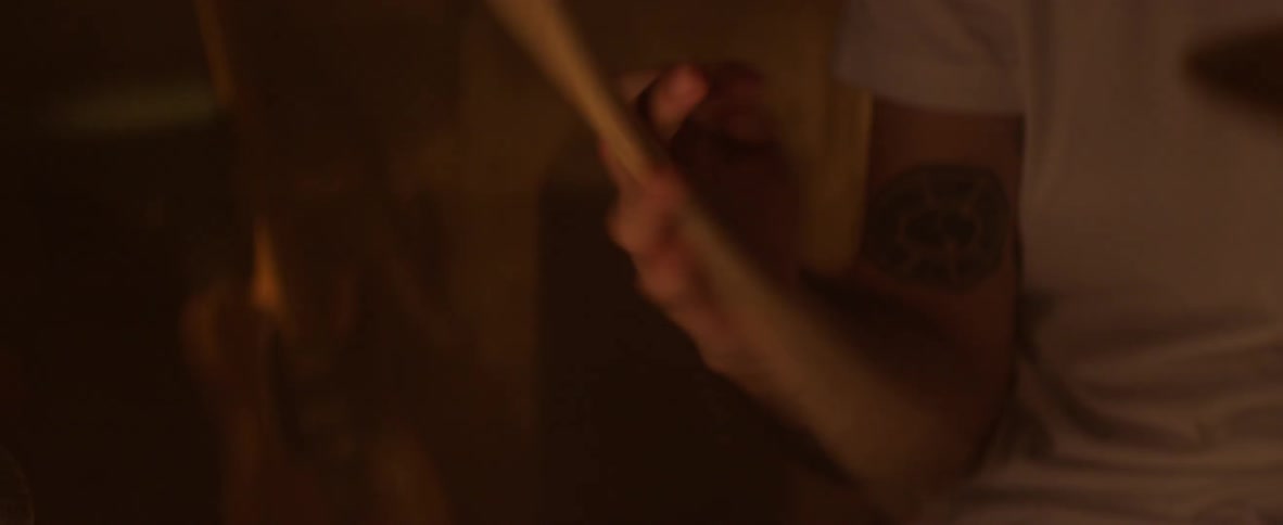 A drummer spins a drumstick in his hand