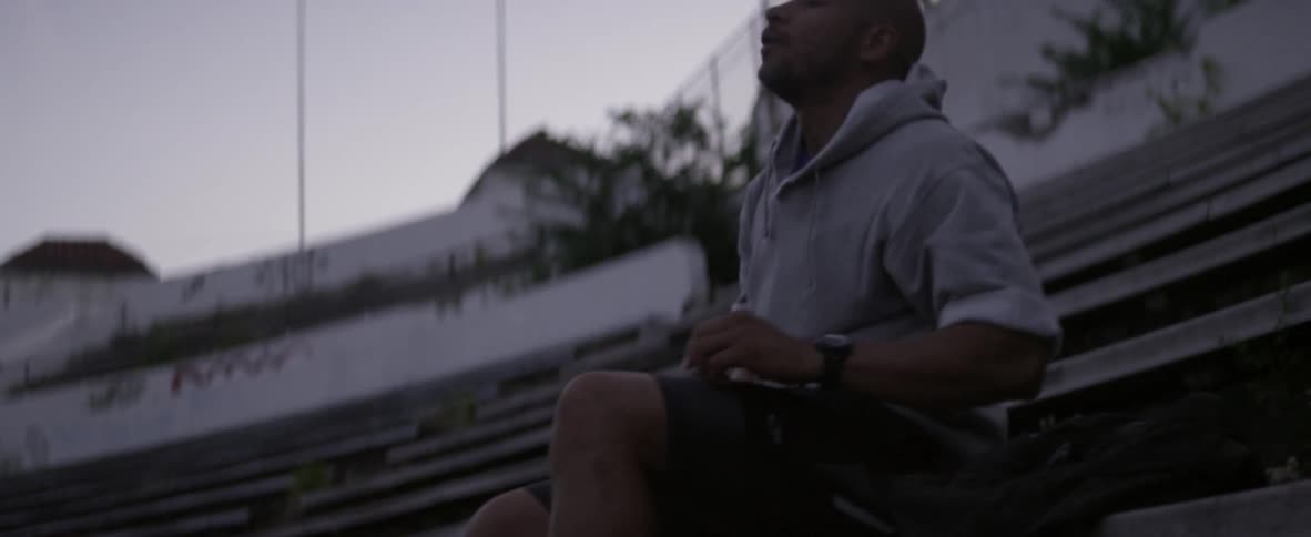 A man is tying his shoes
