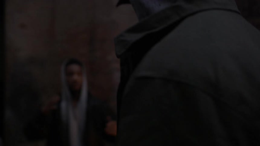 A man runs through the dark alleys worried