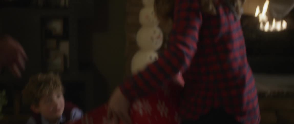 Children pick up gifts and hand some out