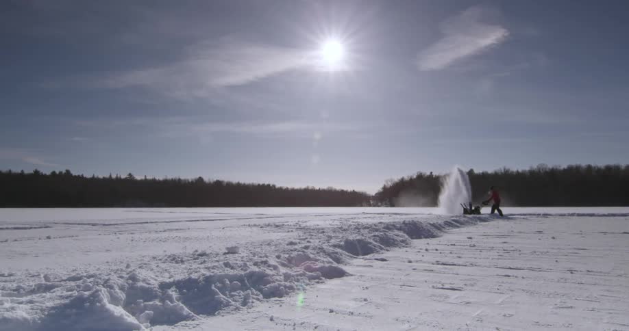 A person using a snow blower