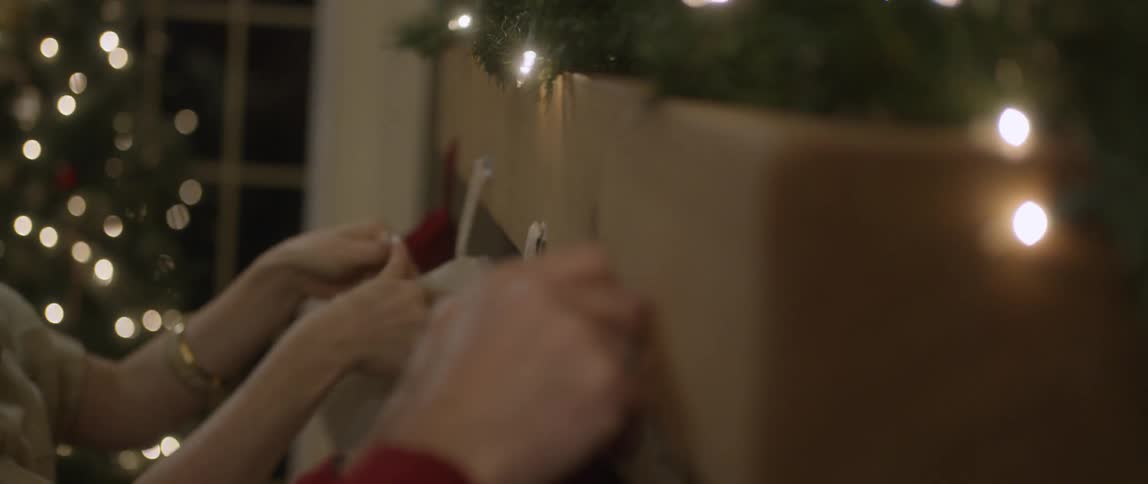 Christmas stockings being hung on a mantle