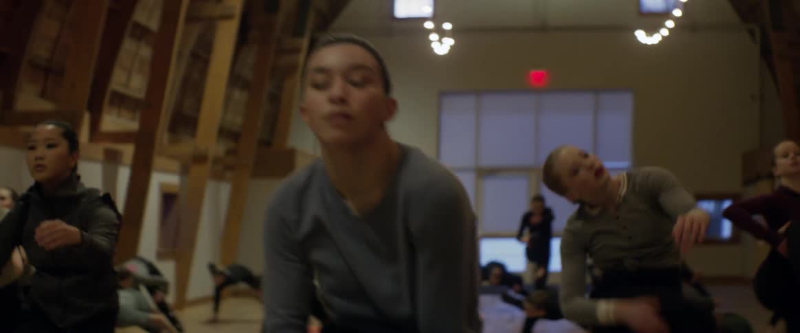 Large group of people dance to choreography