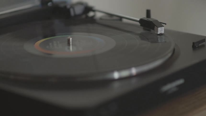 A record is spinning on a record player