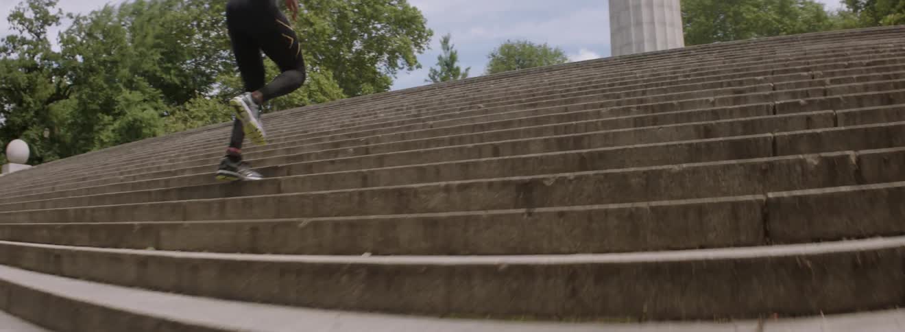 A man races up steps