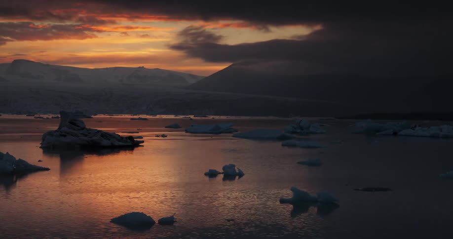 Clouds floating over glacier filled body of water