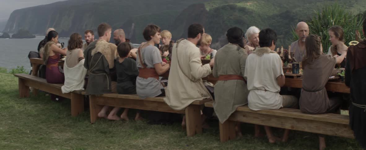 People dine at an outdoor table