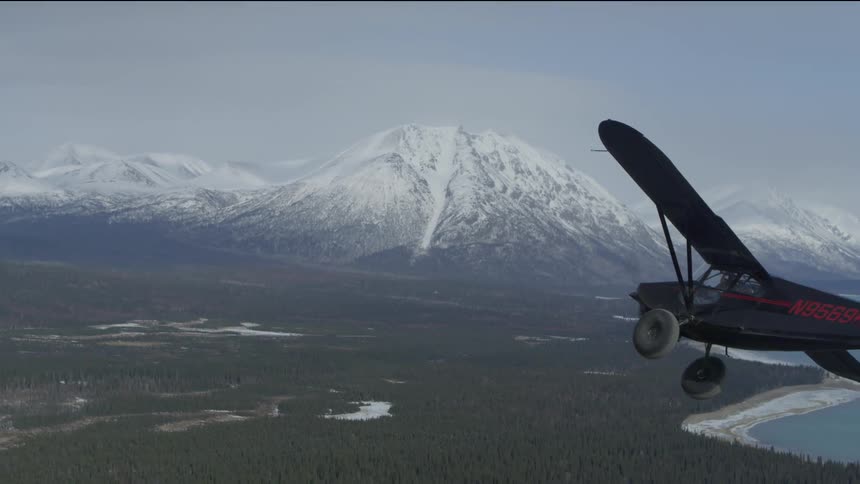 plane fly's over lake in Alaska