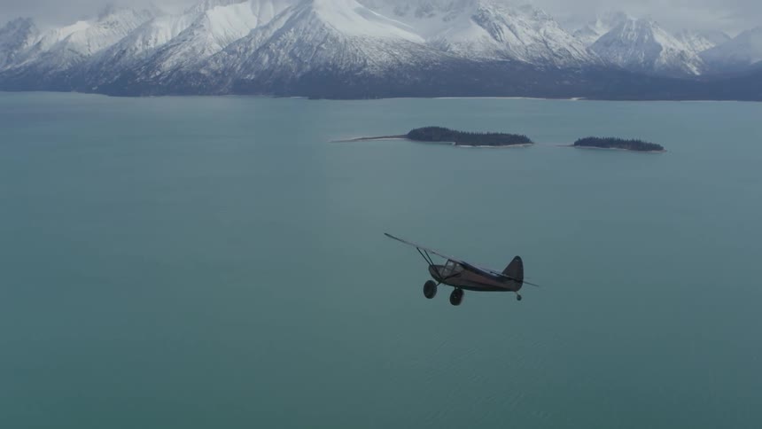 A plane flying over a lake
