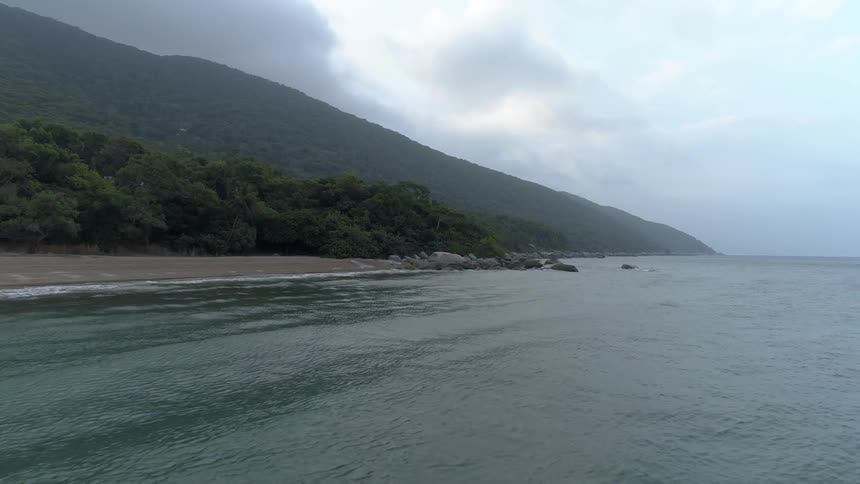 Small waves rolling onto a shore