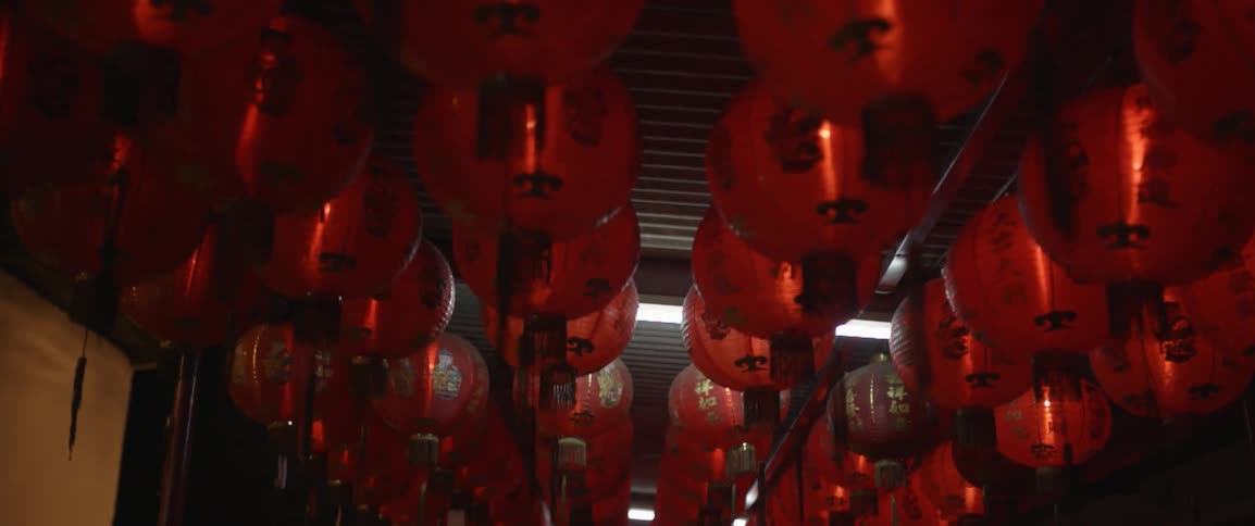 Rows of party lanterns hang above