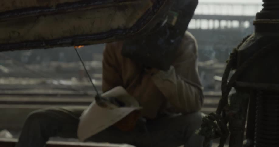 A welder works outside