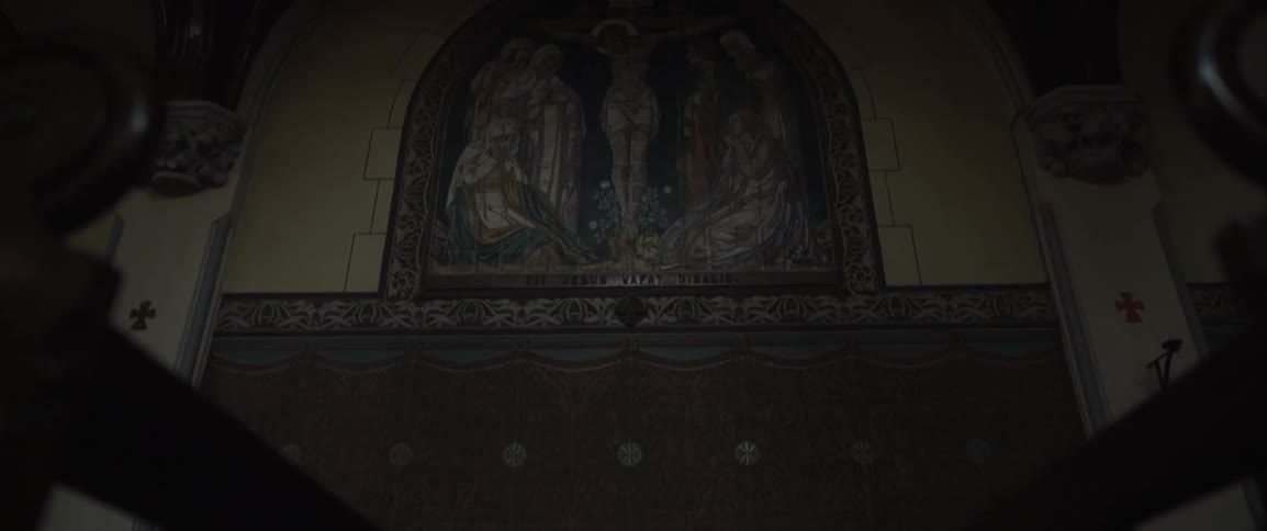 A religious painting hangs in a church