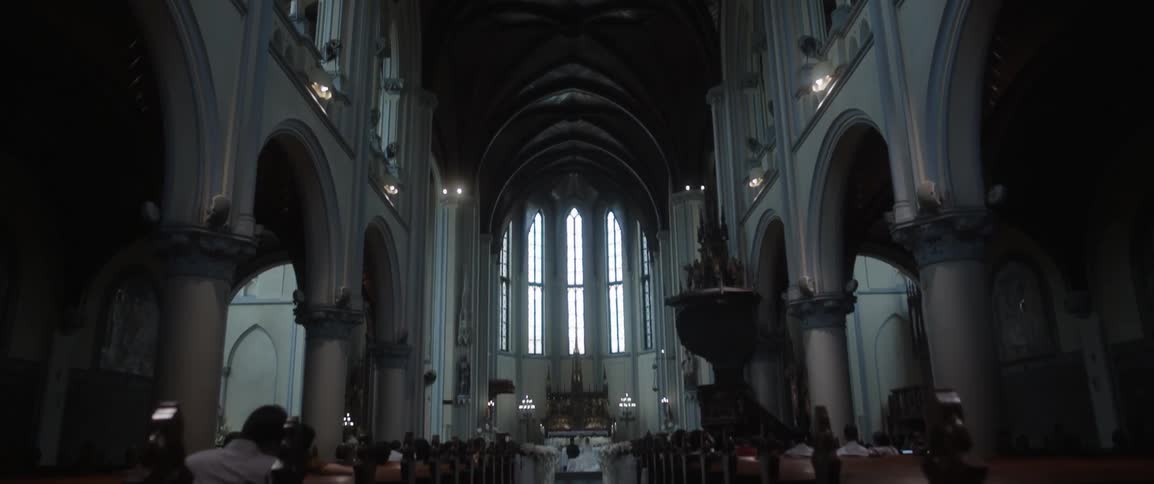 People sit in a chapel