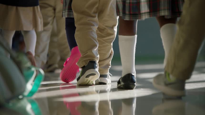 Children walk together in line