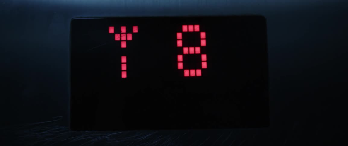 Floor numbers on screen in elevator going down
