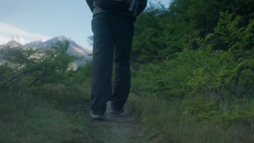 A man walks along a hiking trail
