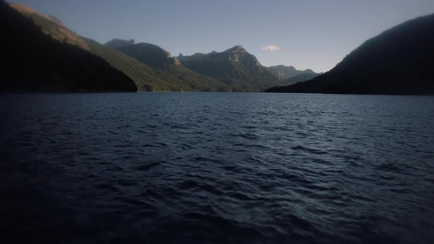 The water below is rough and full of waves