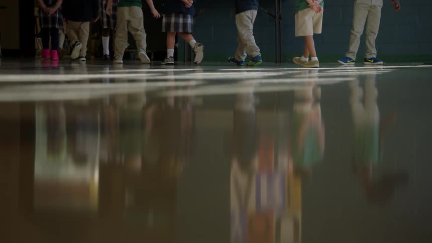 Children walk down the hall