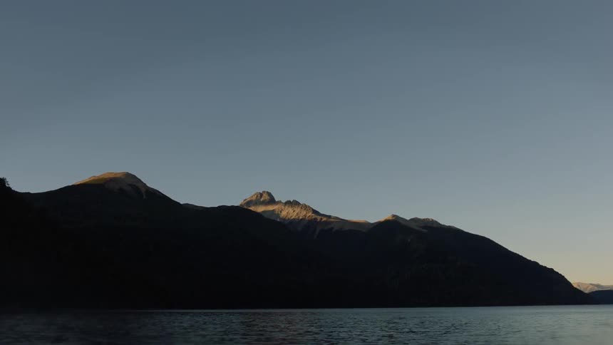 The mountain is covered in shadow ahead